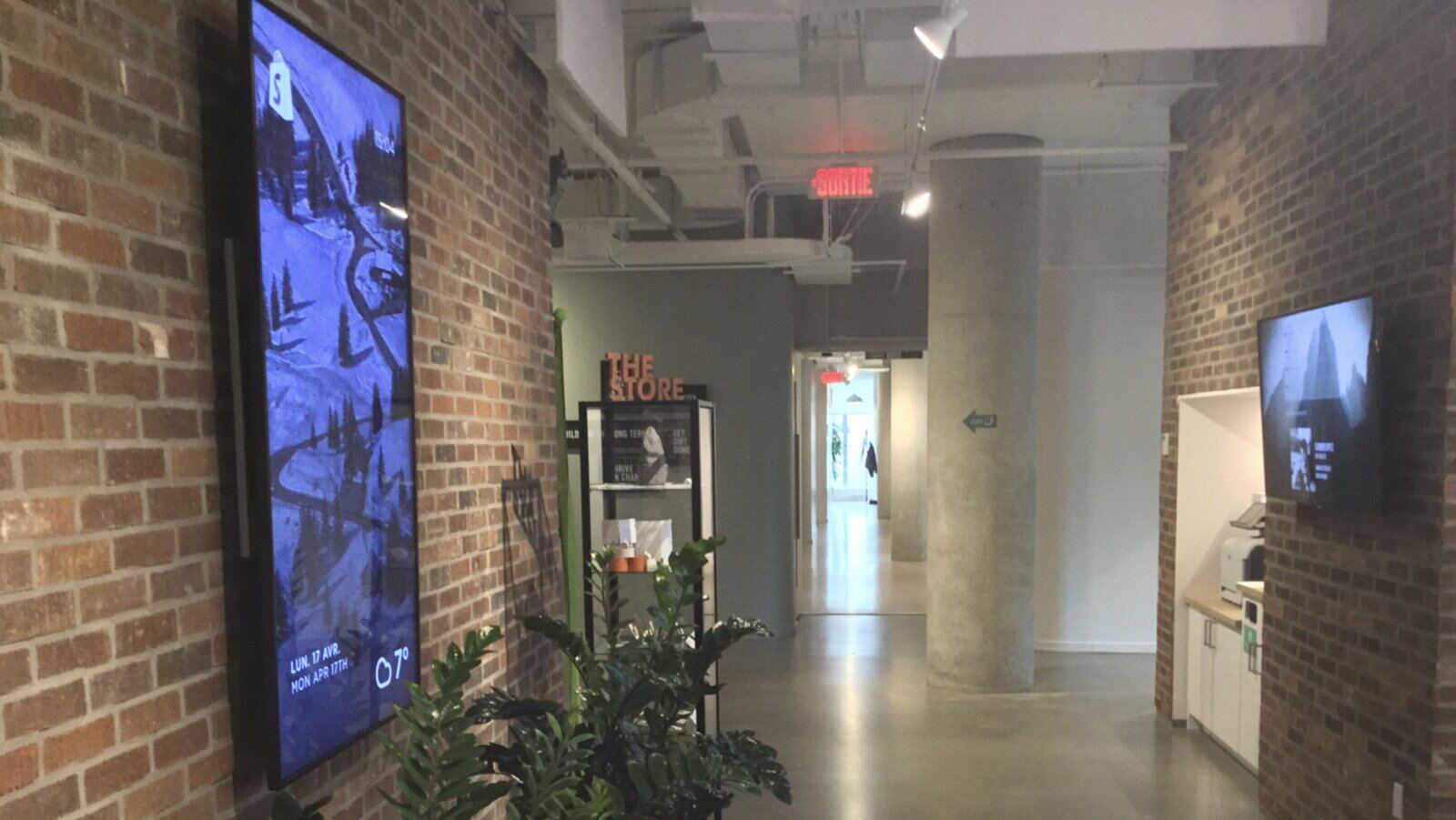 Dashing dashboards lining the walls of Shopify's Montreal office